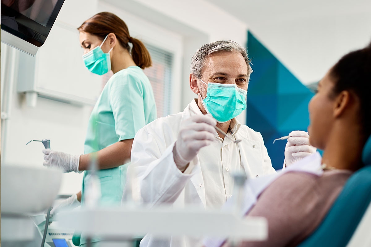 Dentist with patient